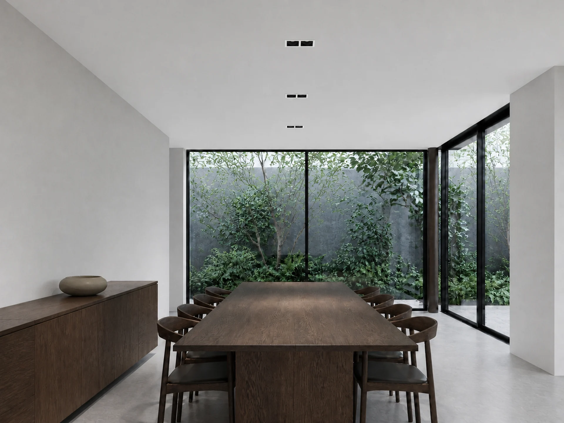Dark downlights used above a contemporary dining table