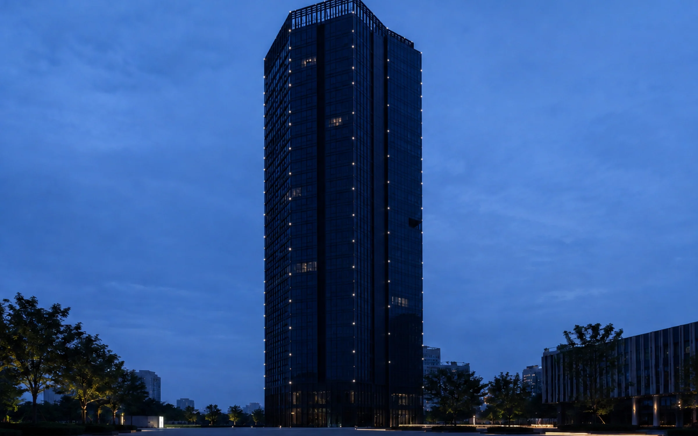 Pixel lighting arranged along the vertical lines of a contemporary facade