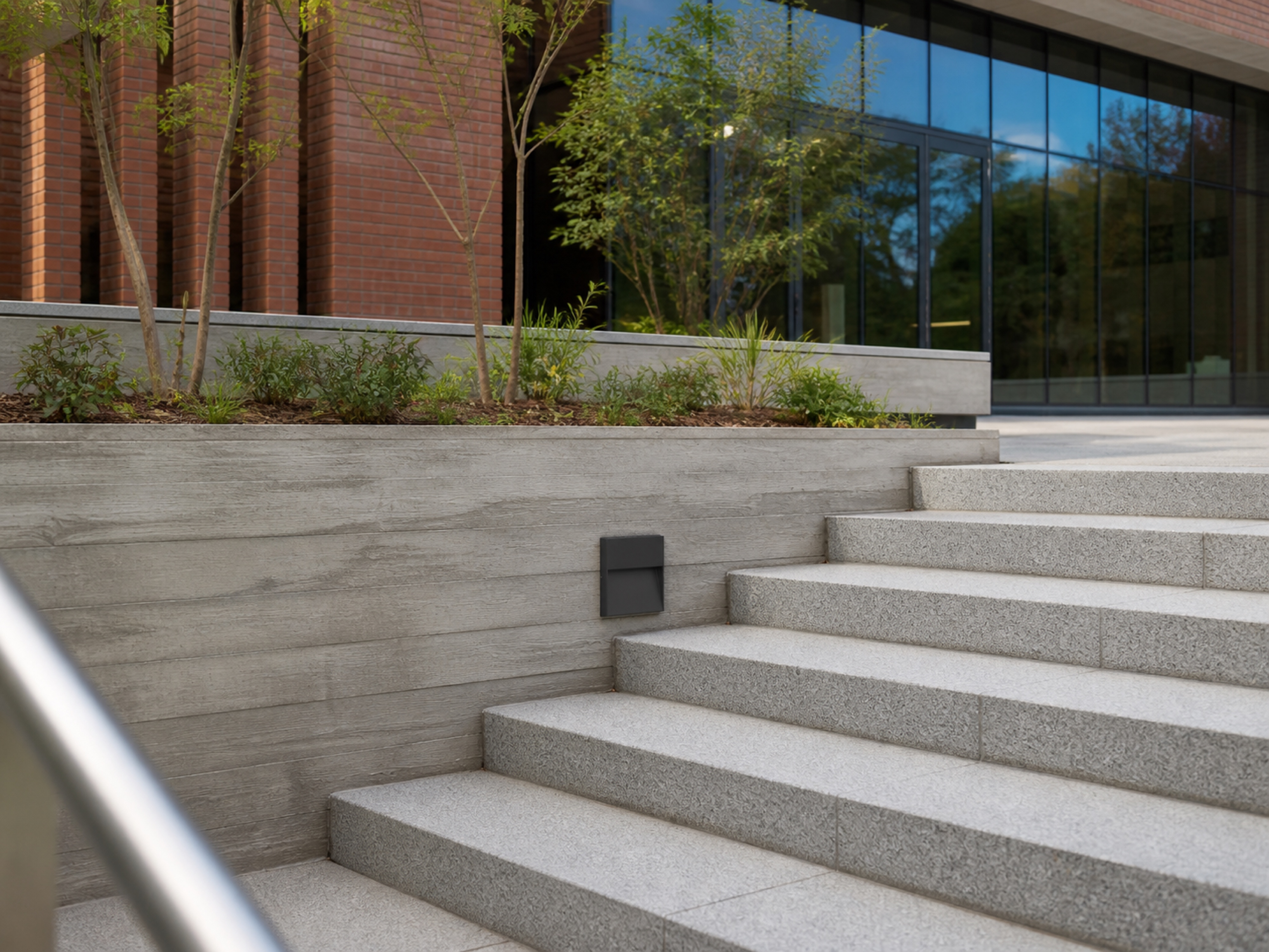 SL02 square step light integrated beside exterior stairs in daylight