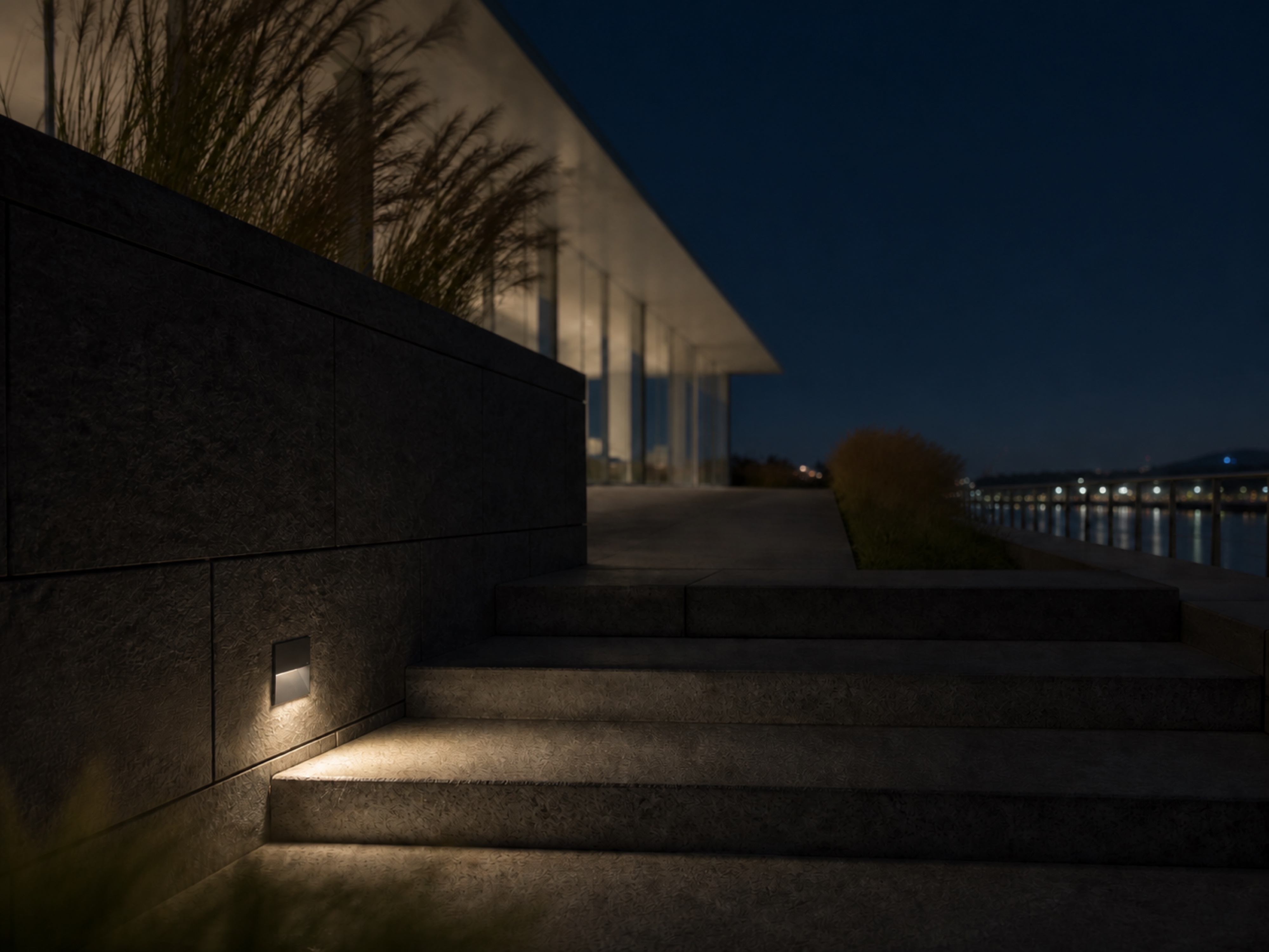 SL02 square step light guiding exterior stairs after dark