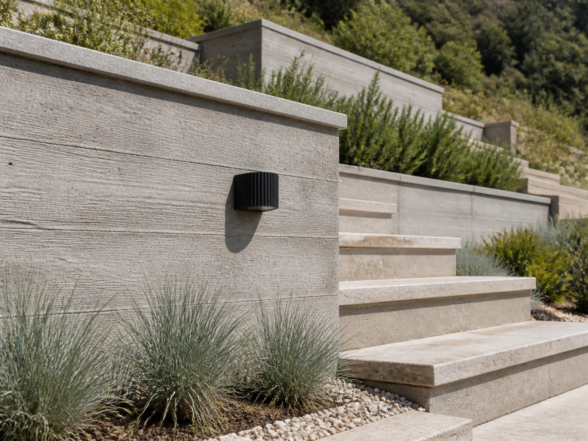WL05 ribbed wall light integrated into a landscaped exterior wall in daylight