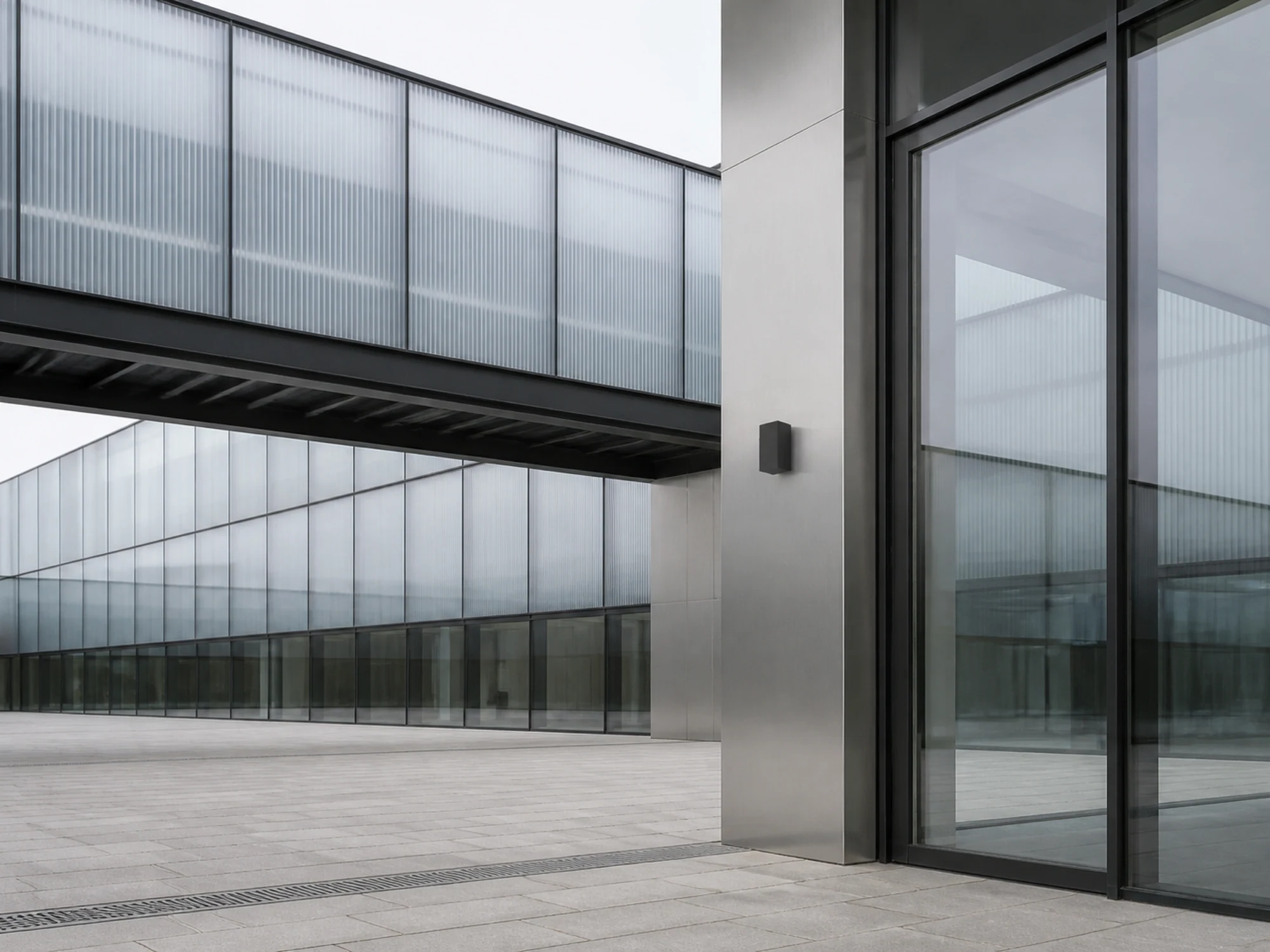 WL08D wall light mounted on a contemporary commercial facade in daylight