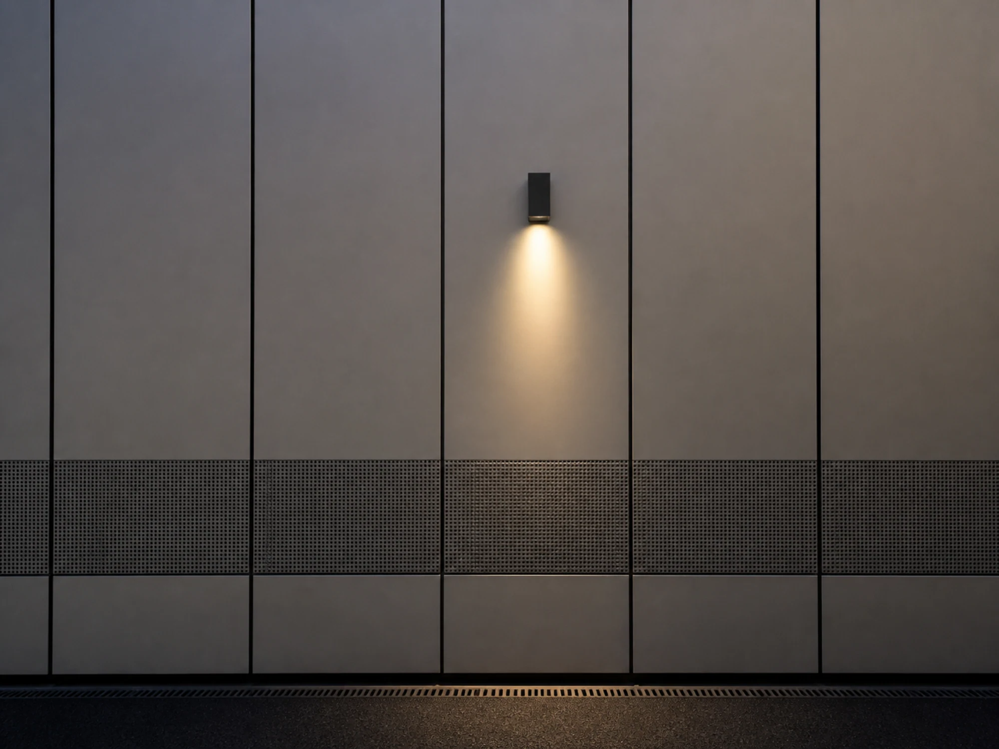 WL08 wall light casting controlled downward light on a panelled facade